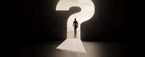 Person walking through a giant question mark-shaped doorway.